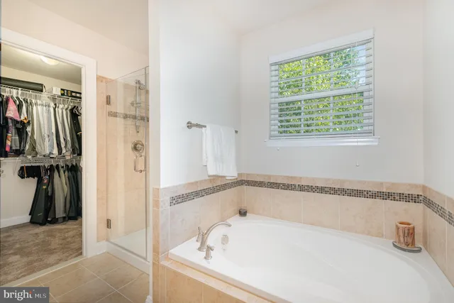 a white bath tub and a shower