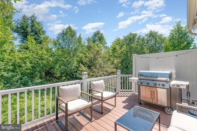 a view of a chairs and table in the balcony