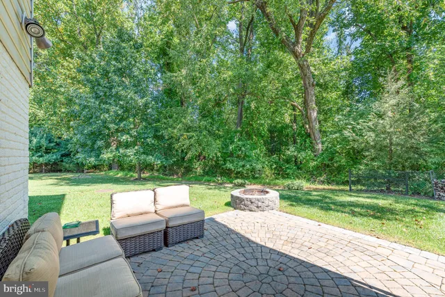 a backyard of a house with outdoor seating