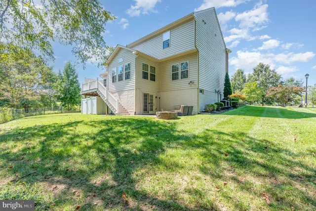 a view of house with backyard