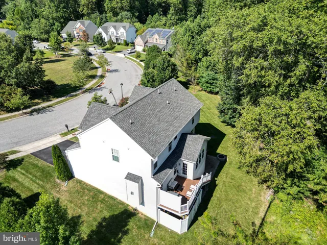 an aerial view of a house with outdoor space