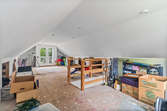 an aerial view of a house with swimming pool and big yard