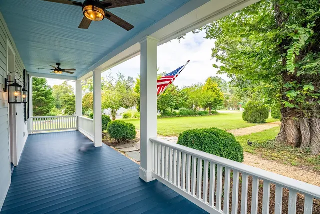 a view of a house with a backyard
