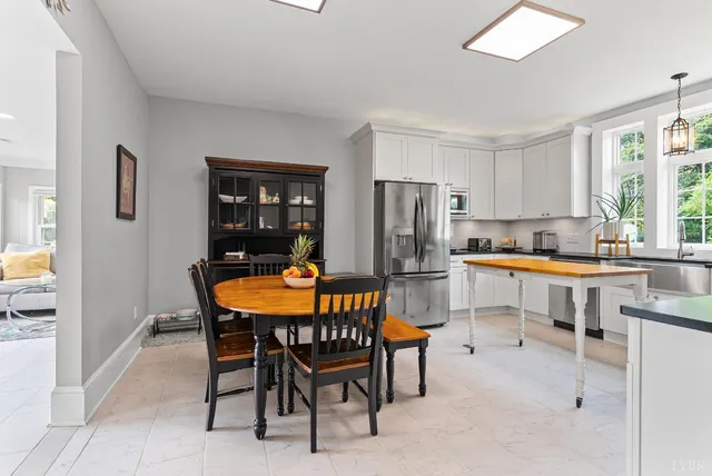a kitchen with stainless steel appliances granite countertop a sink a stove and cabinets