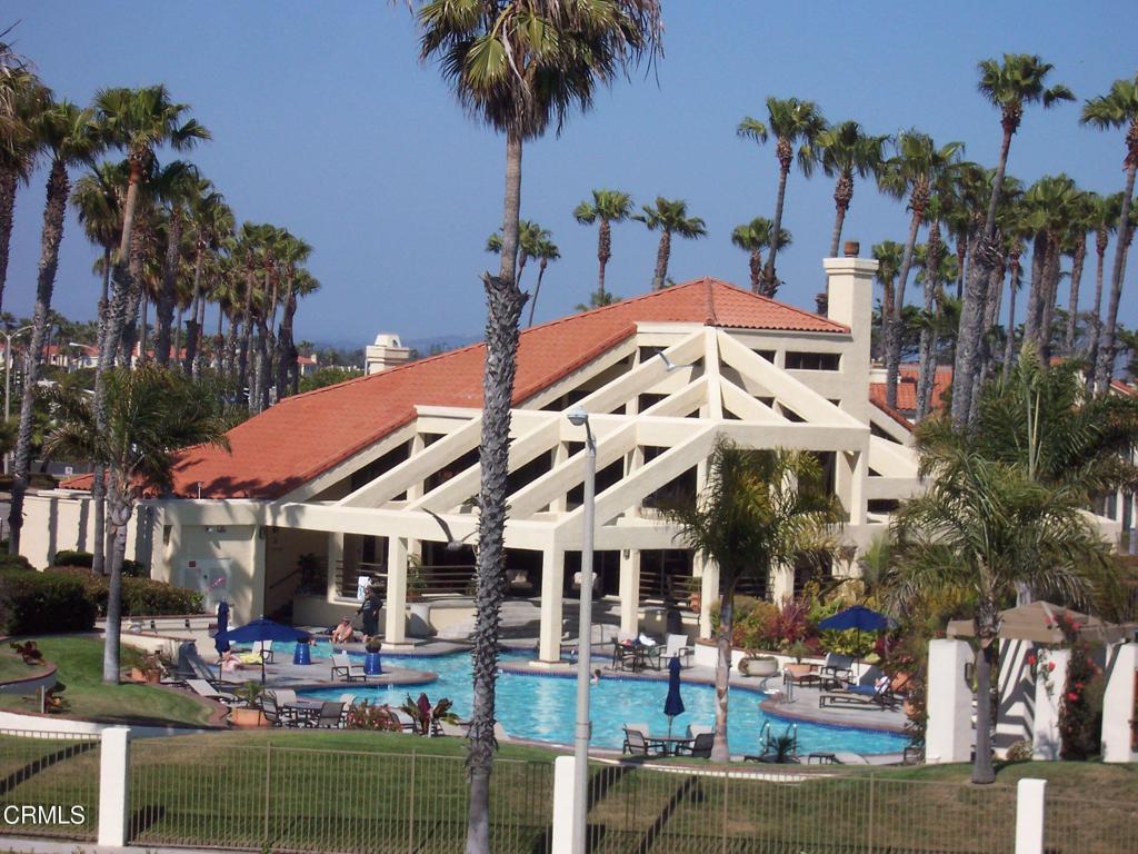 4427 Antigua Way Oxnard, CA 93035 - Photo 34 of 43 a view of a building with a garden and a tree