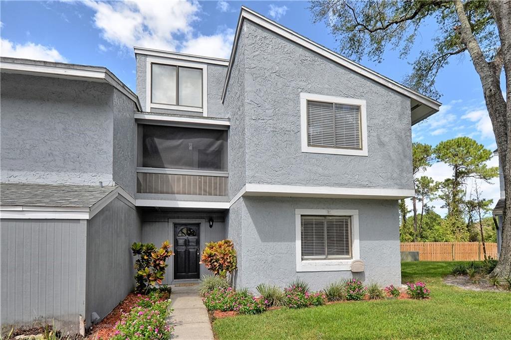 709 St Matthew Circle, Unit 609 Altamonte Springs, FL 32714 - Photo 1 of 1 a front view of a house with garden