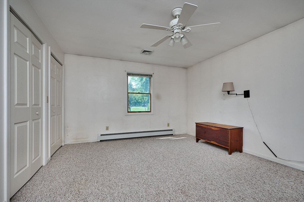 43 Loudville Road Easthampton, MA 01027 - Photo 11 of 34 an empty room with windows and fan
