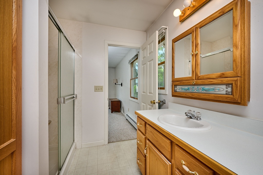 43 Loudville Road Easthampton, MA 01027 - Photo 14 of 34 a bathroom with a sink and a mirror