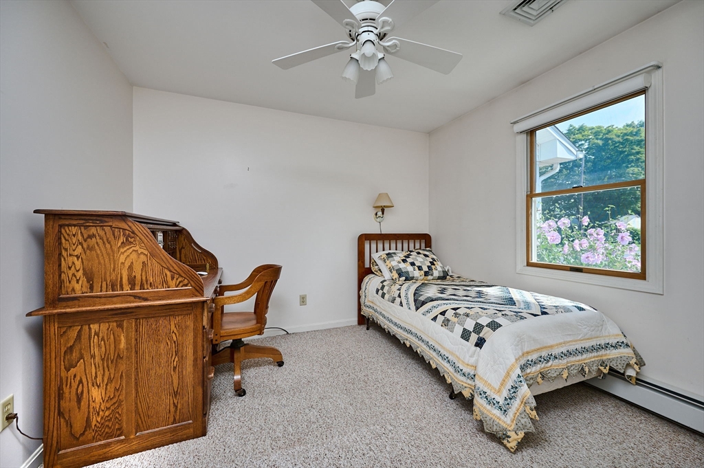 43 Loudville Road Easthampton, MA 01027 - Photo 15 of 34 a bedroom with a bed and wooden floor