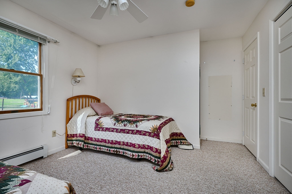 43 Loudville Road Easthampton, MA 01027 - Photo 18 of 34 a bedroom with a bed and a window