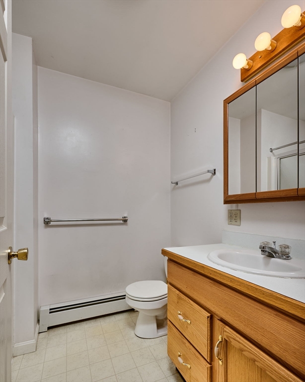43 Loudville Road Easthampton, MA 01027 - Photo 19 of 34 a bathroom with a granite countertop toilet sink mirror and vanity