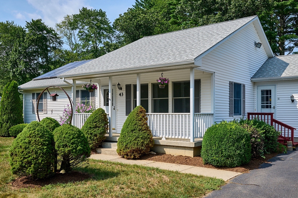 43 Loudville Road Easthampton, MA 01027 - Photo 2 of 34 a view of a house with a garden and plants