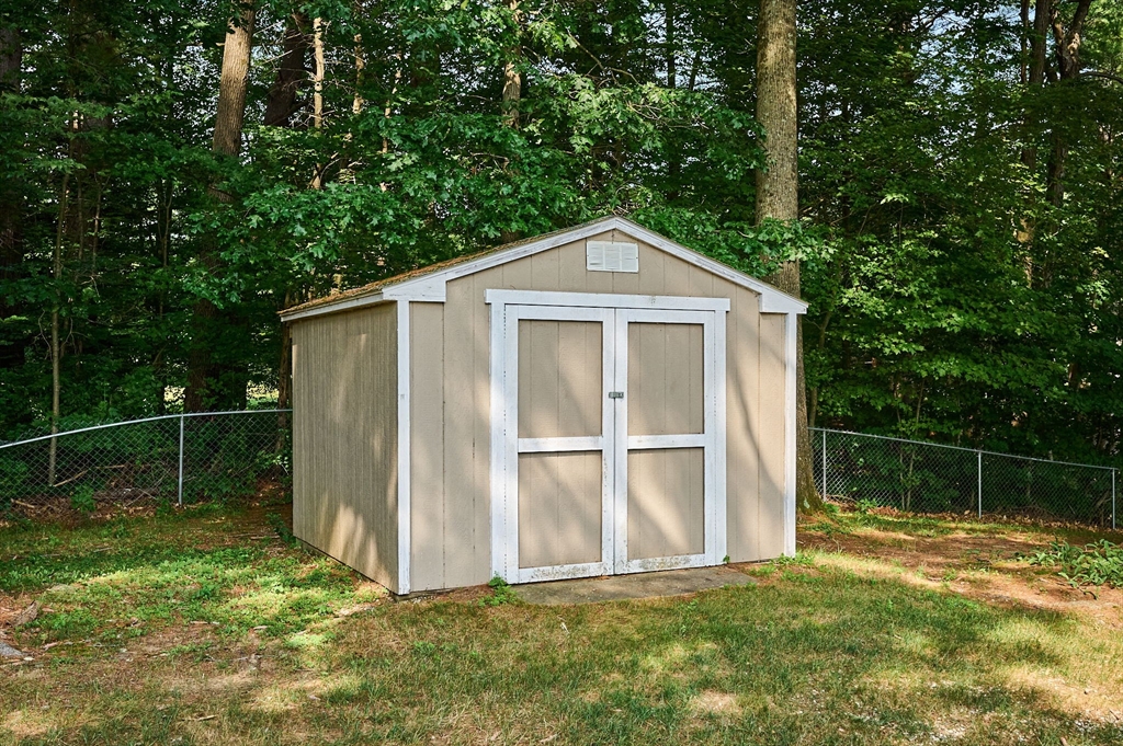 43 Loudville Road Easthampton, MA 01027 - Photo 26 of 34 a backyard of a house with plants and large tree