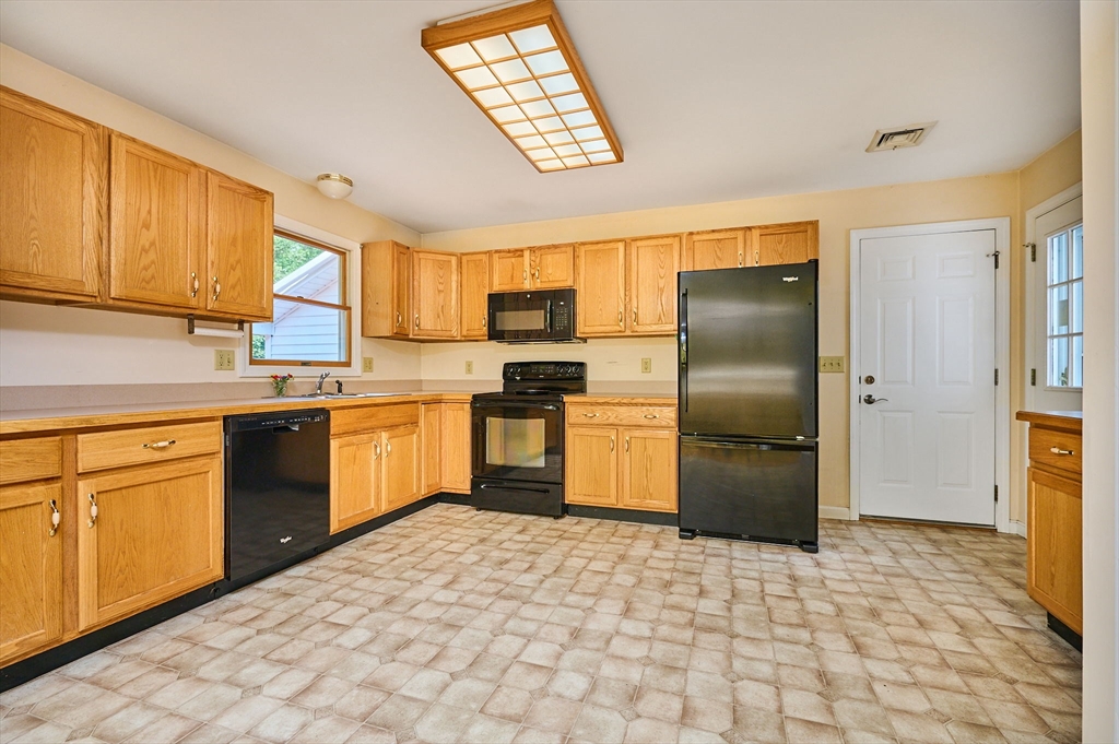 43 Loudville Road Easthampton, MA 01027 - Photo 3 of 34 a kitchen with a refrigerator sink and cabinets