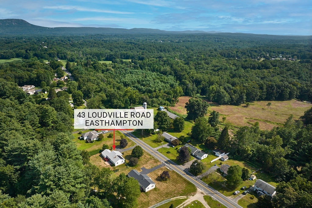 43 Loudville Road Easthampton, MA 01027 - Photo 31 of 34 a sign that is sitting in the middle of a field