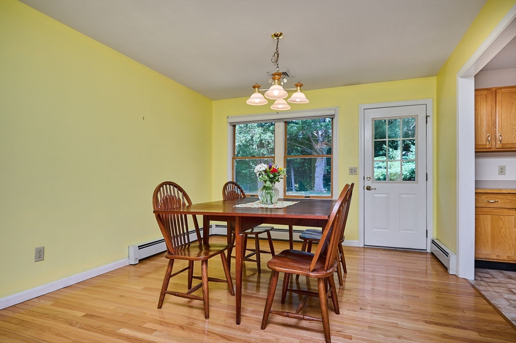 43 Loudville Road Easthampton, MA 01027 - Photo 7 of 34 a view of a dining room with furniture wooden floor and chandelier