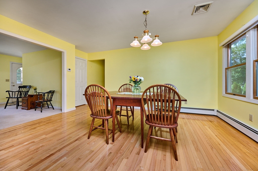 43 Loudville Road Easthampton, MA 01027 - Photo 8 of 34 a view of a dining room with furniture a chandelier and wooden floor