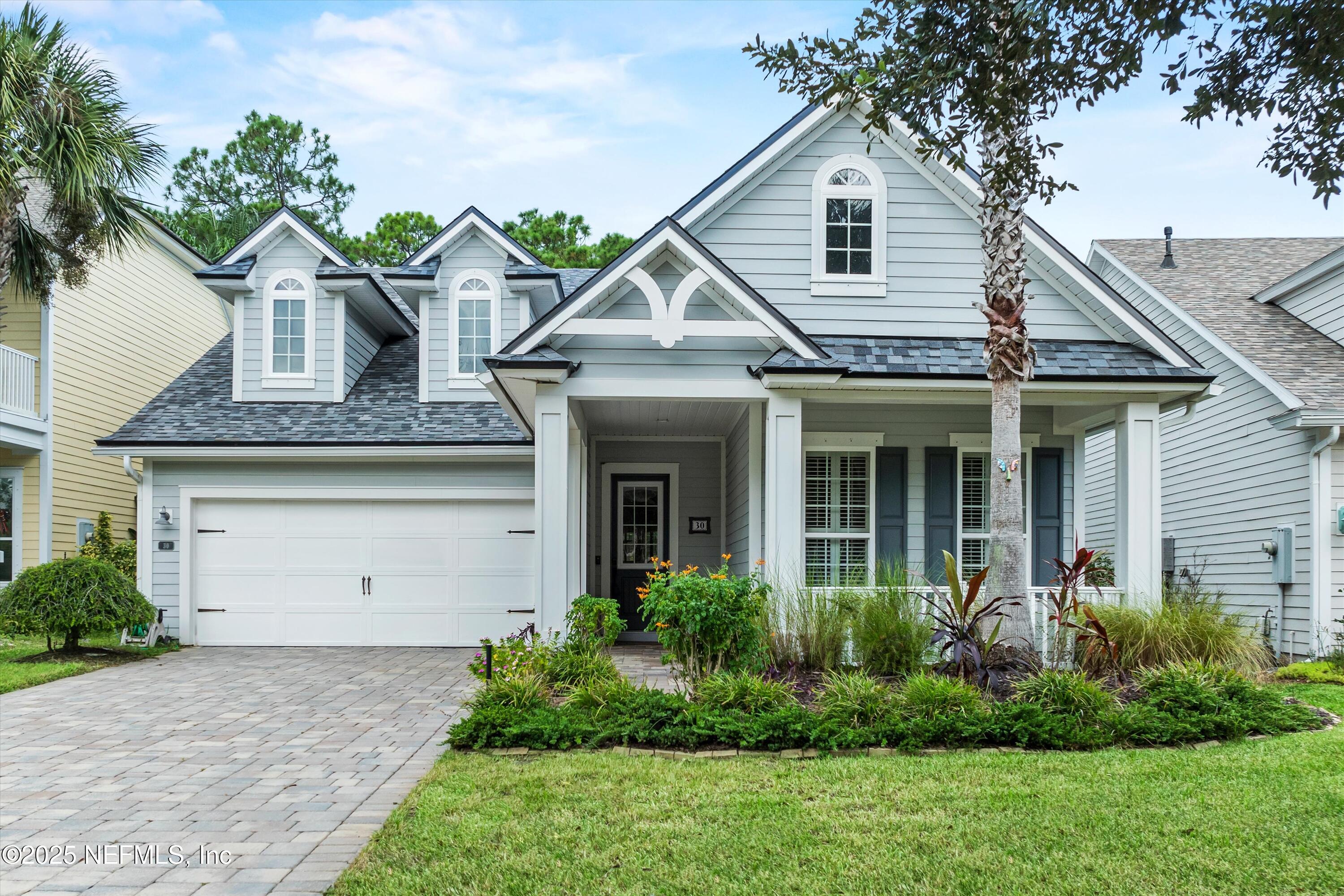 30 Pelican Pointe Road Ponte Vedra, FL 32081 - Photo 1 of 66 a front view of a house with a garden and plants