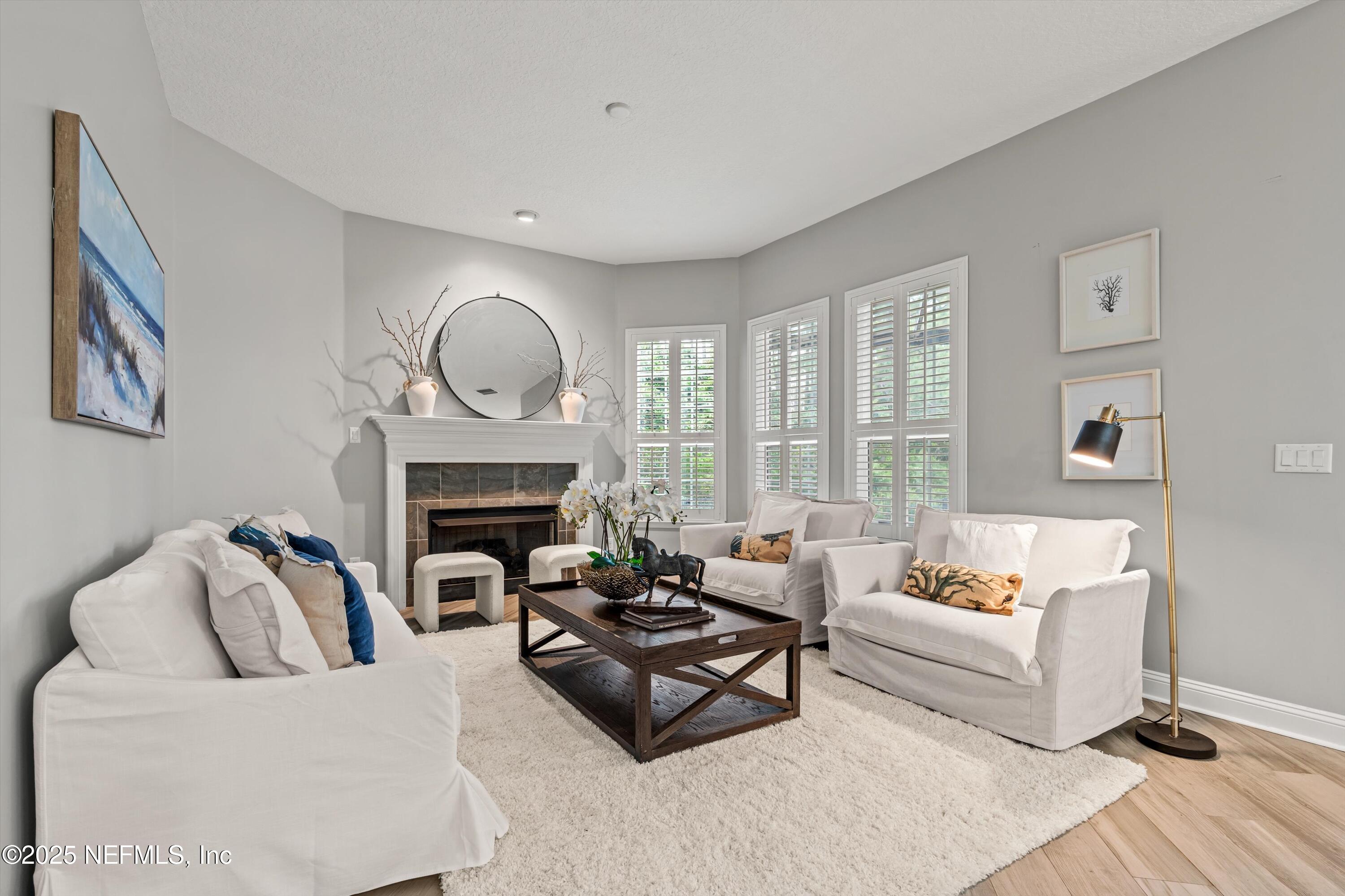 30 Pelican Pointe Road Ponte Vedra, FL 32081 - Photo 14 of 66 a living room with furniture and a fireplace