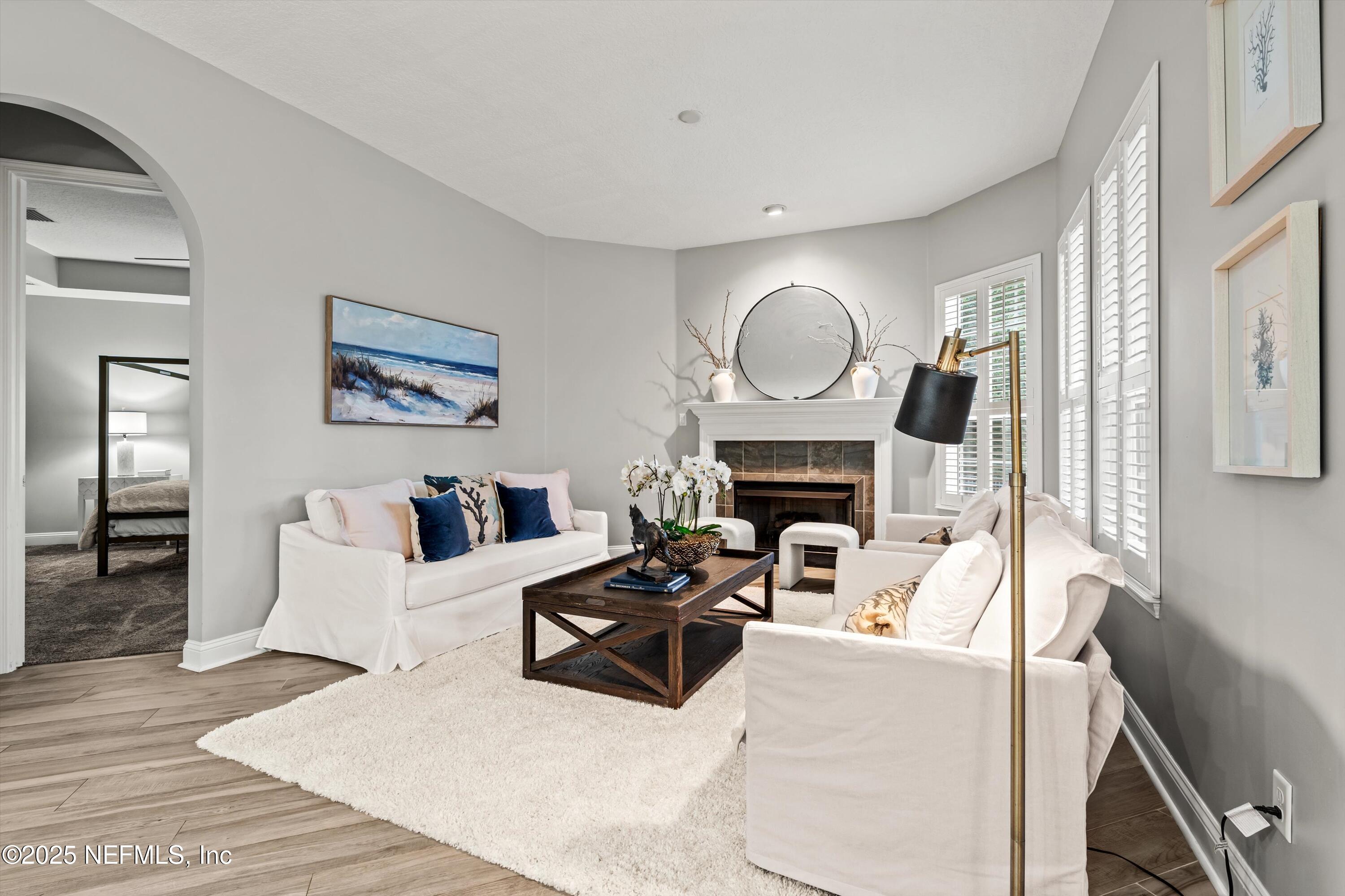 30 Pelican Pointe Road Ponte Vedra, FL 32081 - Photo 16 of 66 a living room with furniture a fireplace and wooden floor