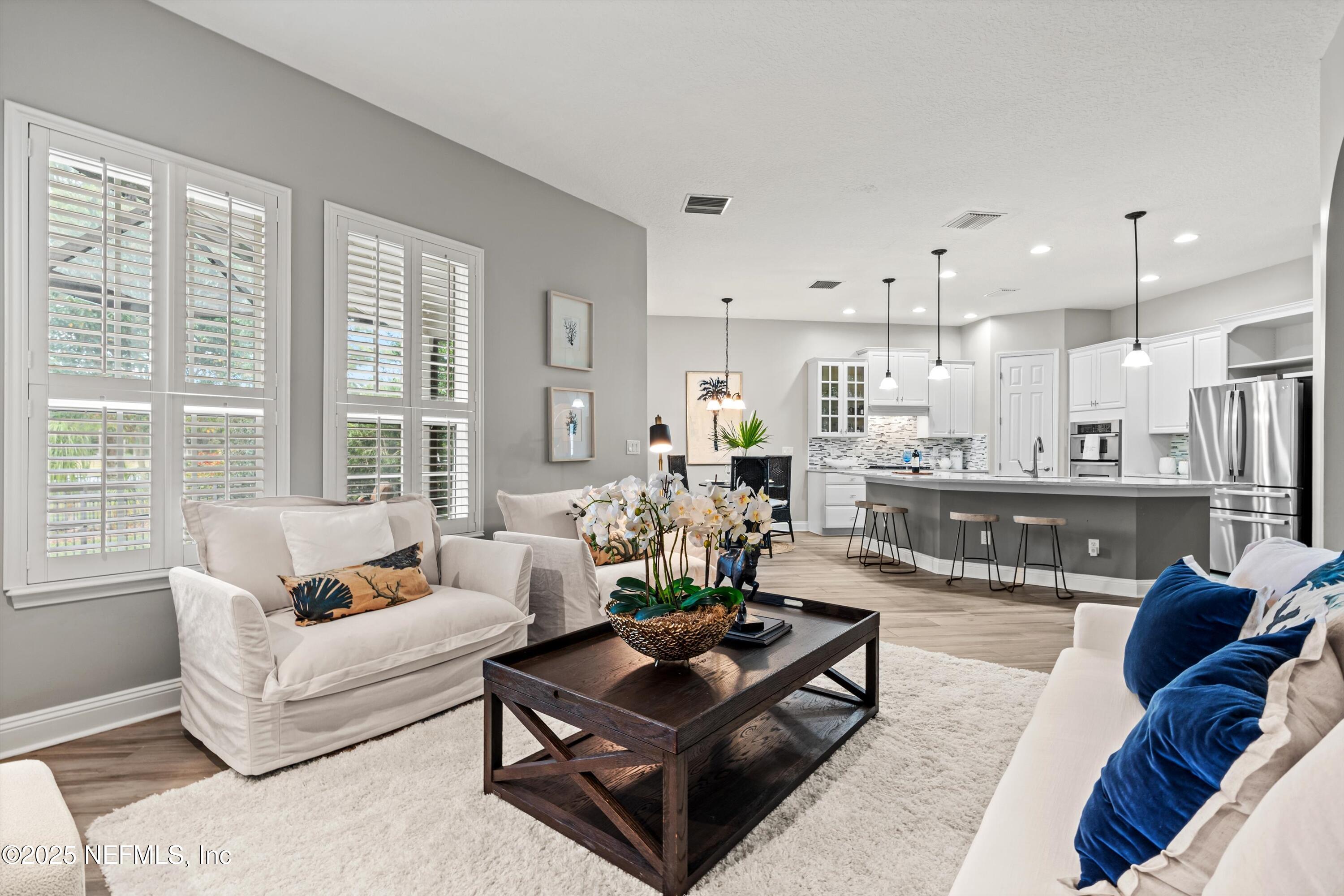 30 Pelican Pointe Road Ponte Vedra, FL 32081 - Photo 17 of 66 a living room with furniture and a large window