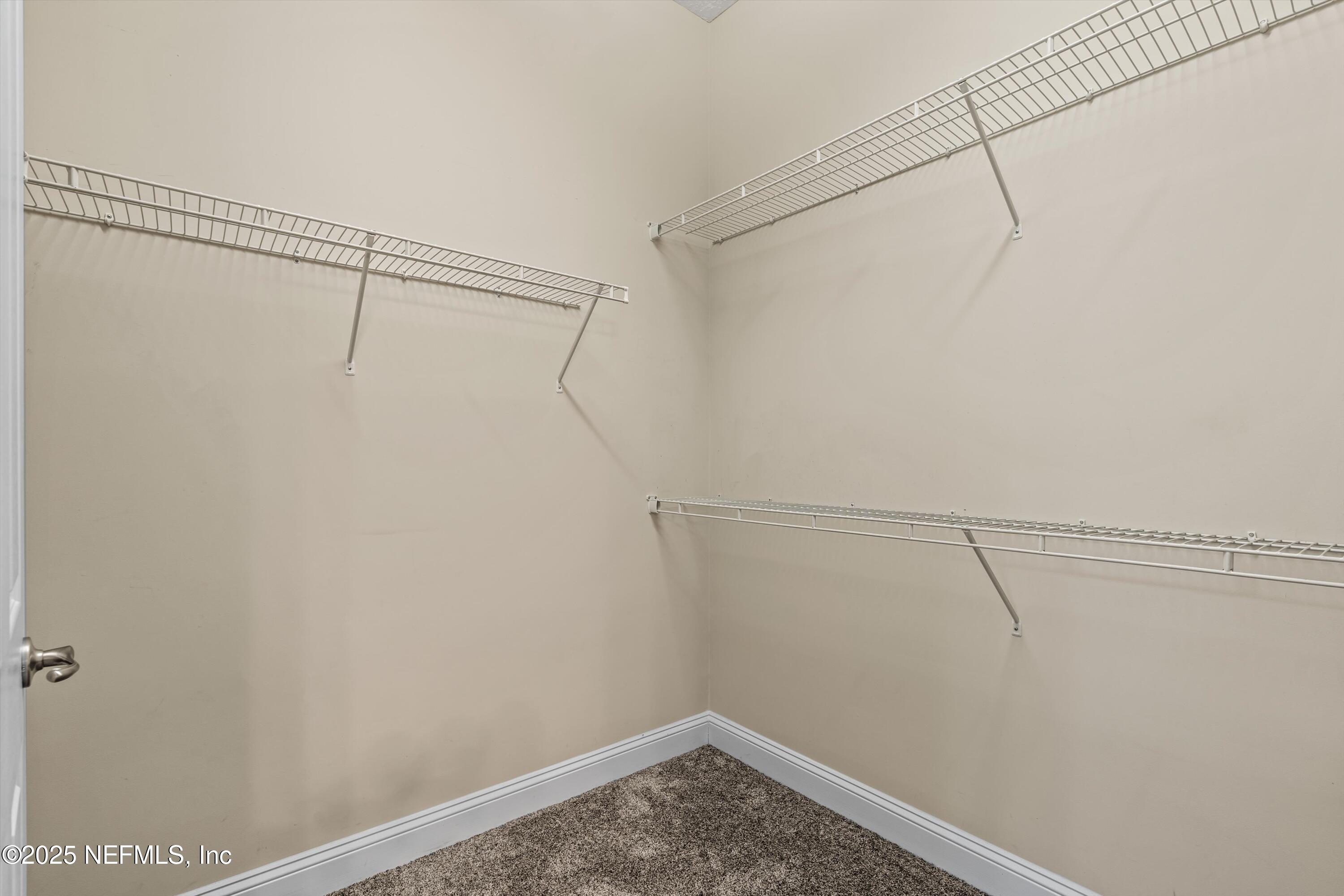 30 Pelican Pointe Road Ponte Vedra, FL 32081 - Photo 21 of 66 a view of a room with racks on the wall