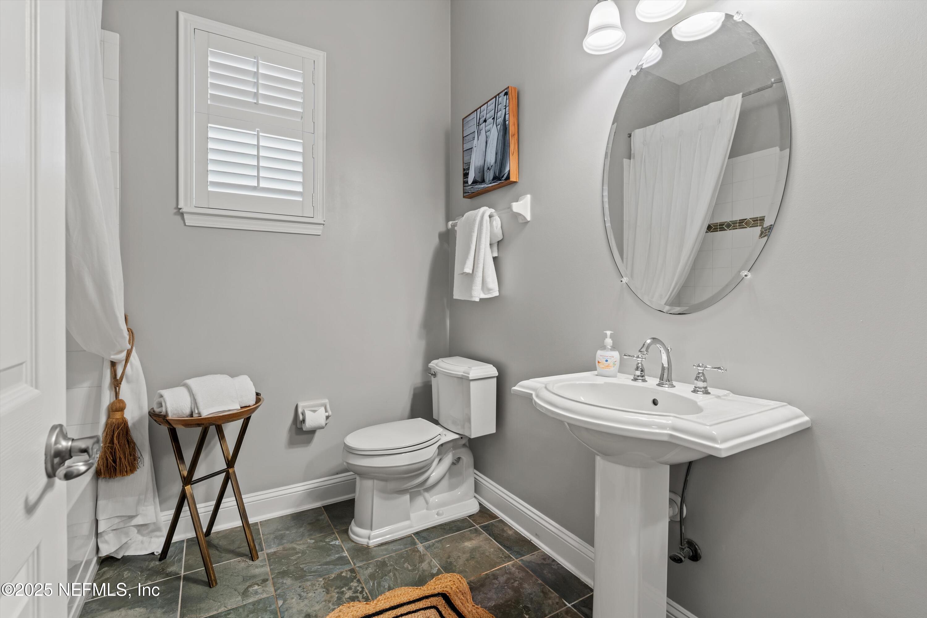 30 Pelican Pointe Road Ponte Vedra, FL 32081 - Photo 26 of 66 a bathroom with a sink toilet and a mirror