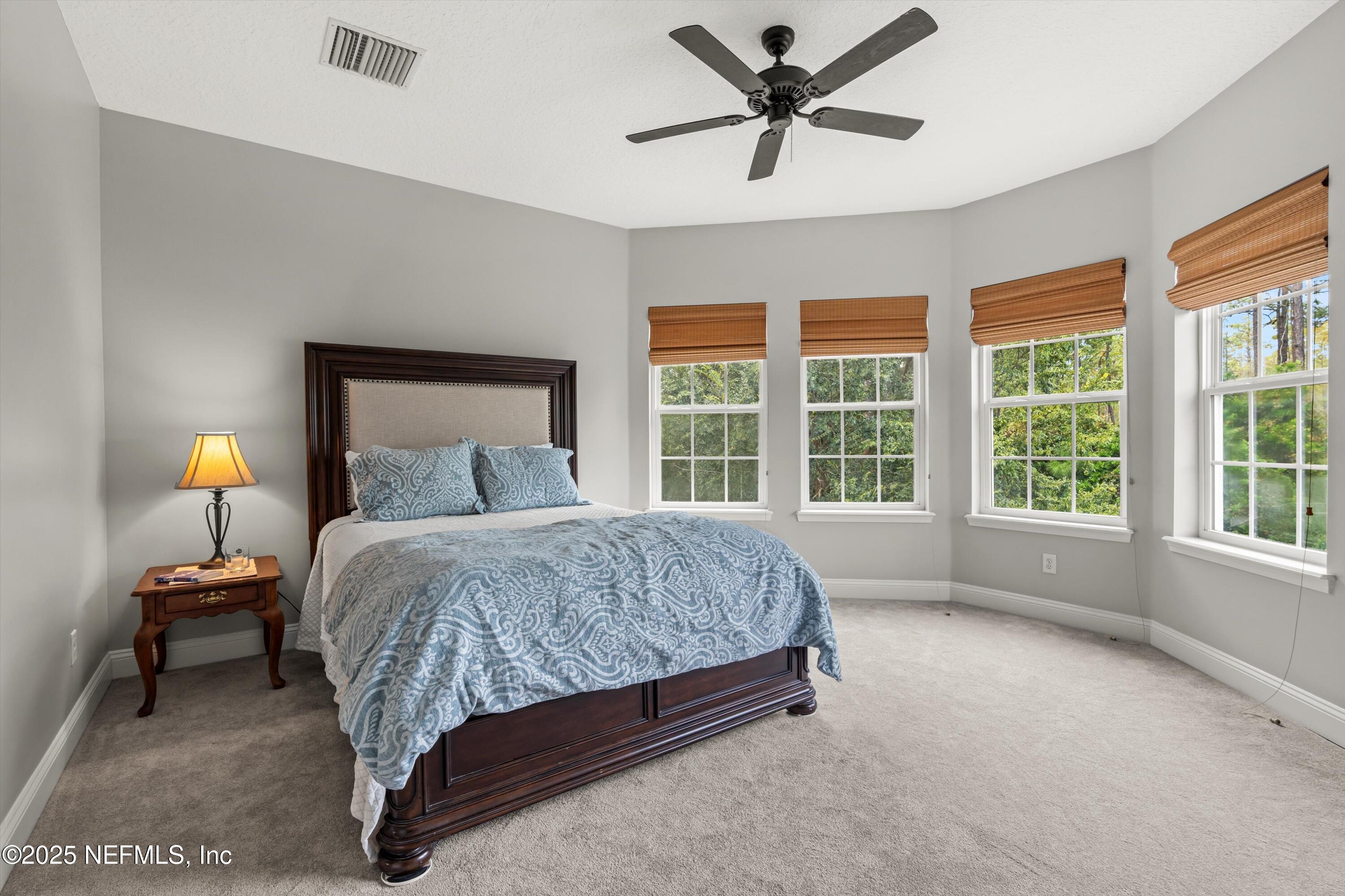30 Pelican Pointe Road Ponte Vedra, FL 32081 - Photo 29 of 66 a bedroom with a large bed and a large window