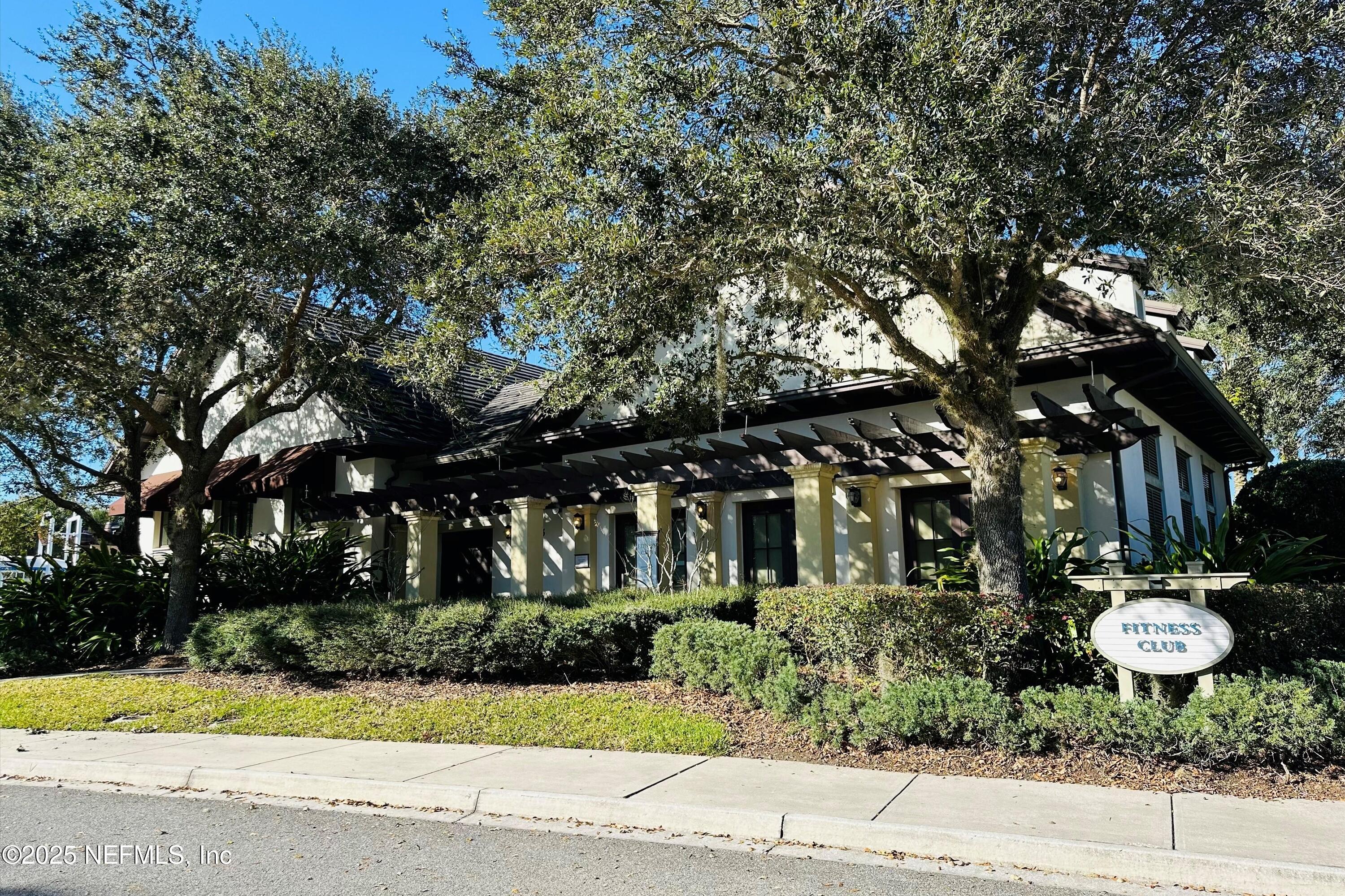 30 Pelican Pointe Road Ponte Vedra, FL 32081 - Photo 58 of 66 a front view of a house with a yard and green space