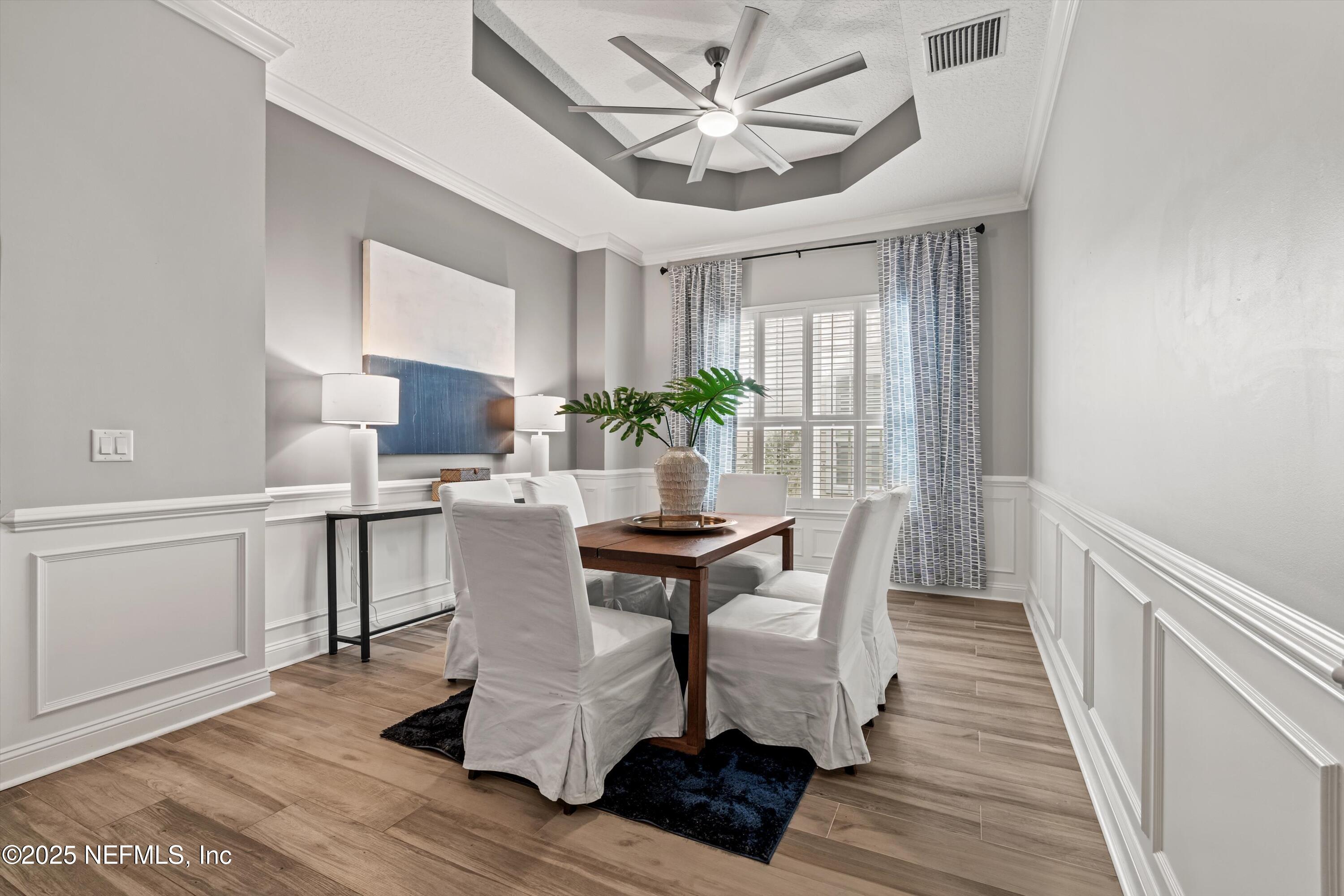 30 Pelican Pointe Road Ponte Vedra, FL 32081 - Photo 8 of 66 a dining room with furniture a chandelier and wooden floor