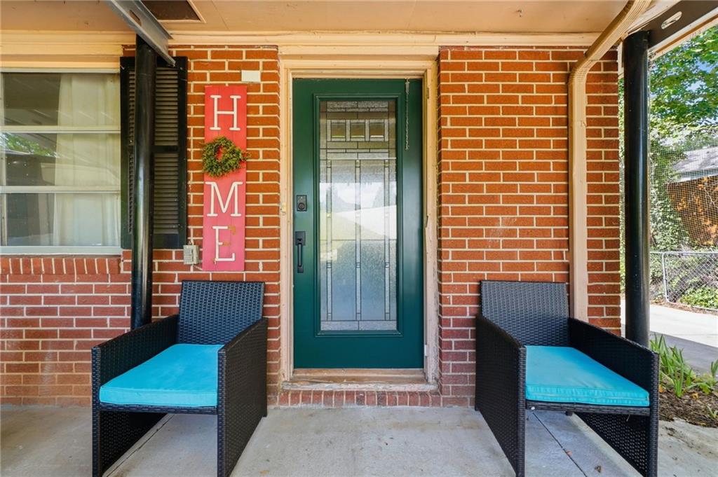 430 Church Road Southwest Marietta, GA 30060 - Photo 4 of 35 a view of wooden door with a chair and a couch