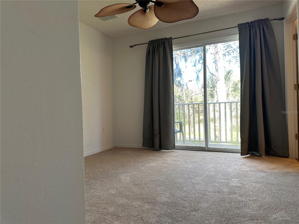 8411 Crystal Cove Loop Kissimmee, FL 34747 - Photo 16 of 43 a view of an empty room with a window