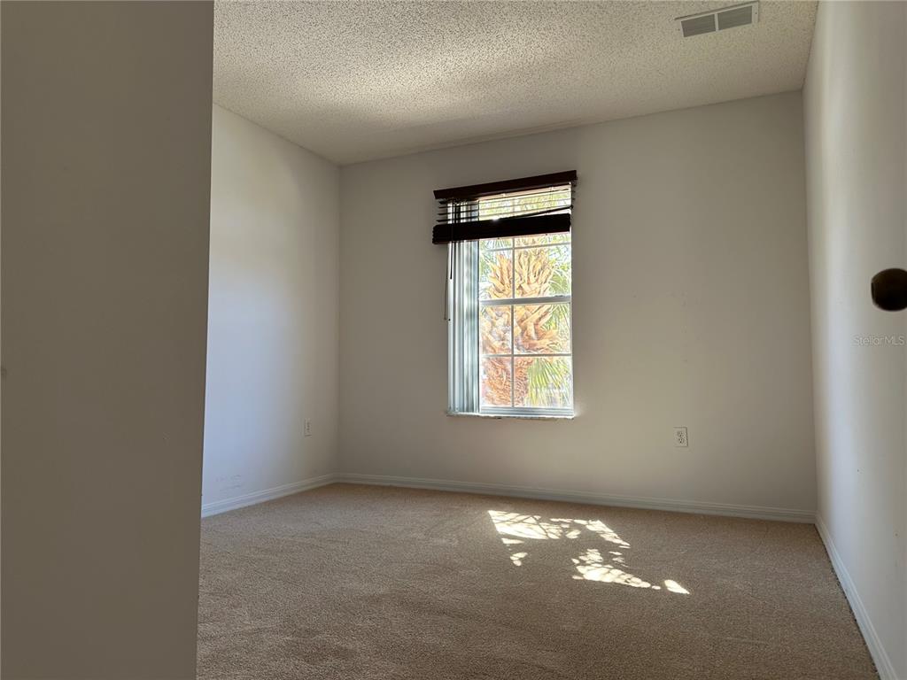 8411 Crystal Cove Loop Kissimmee, FL 34747 - Photo 20 of 43 an empty room with windows