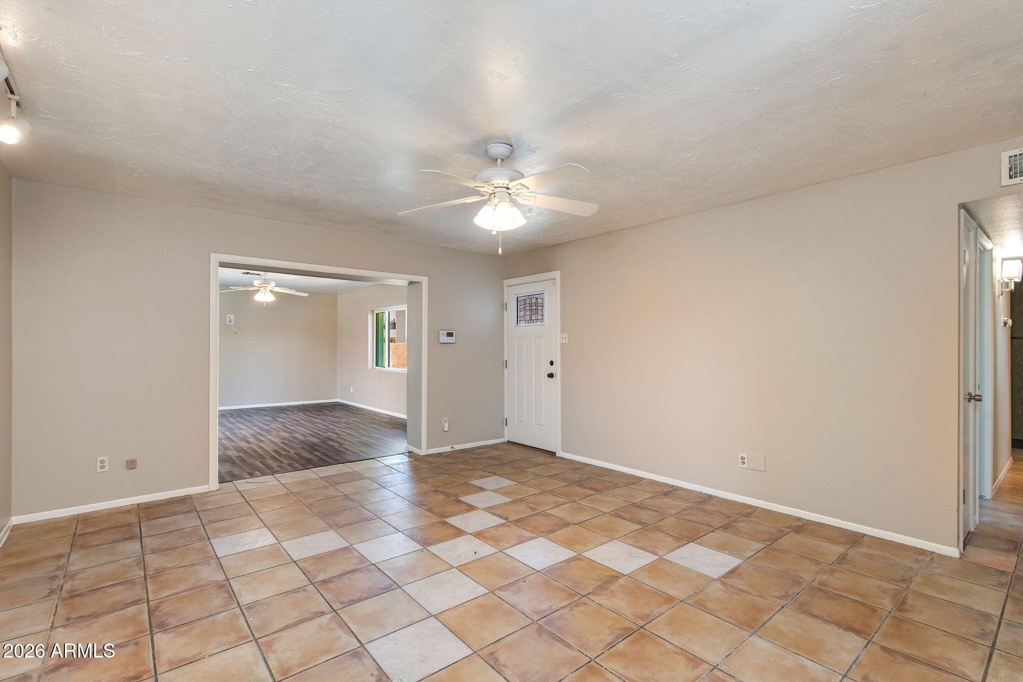 4415 East Chambers Street Phoenix, AZ 85040 - Photo 13 of 33 a view of an empty room and window