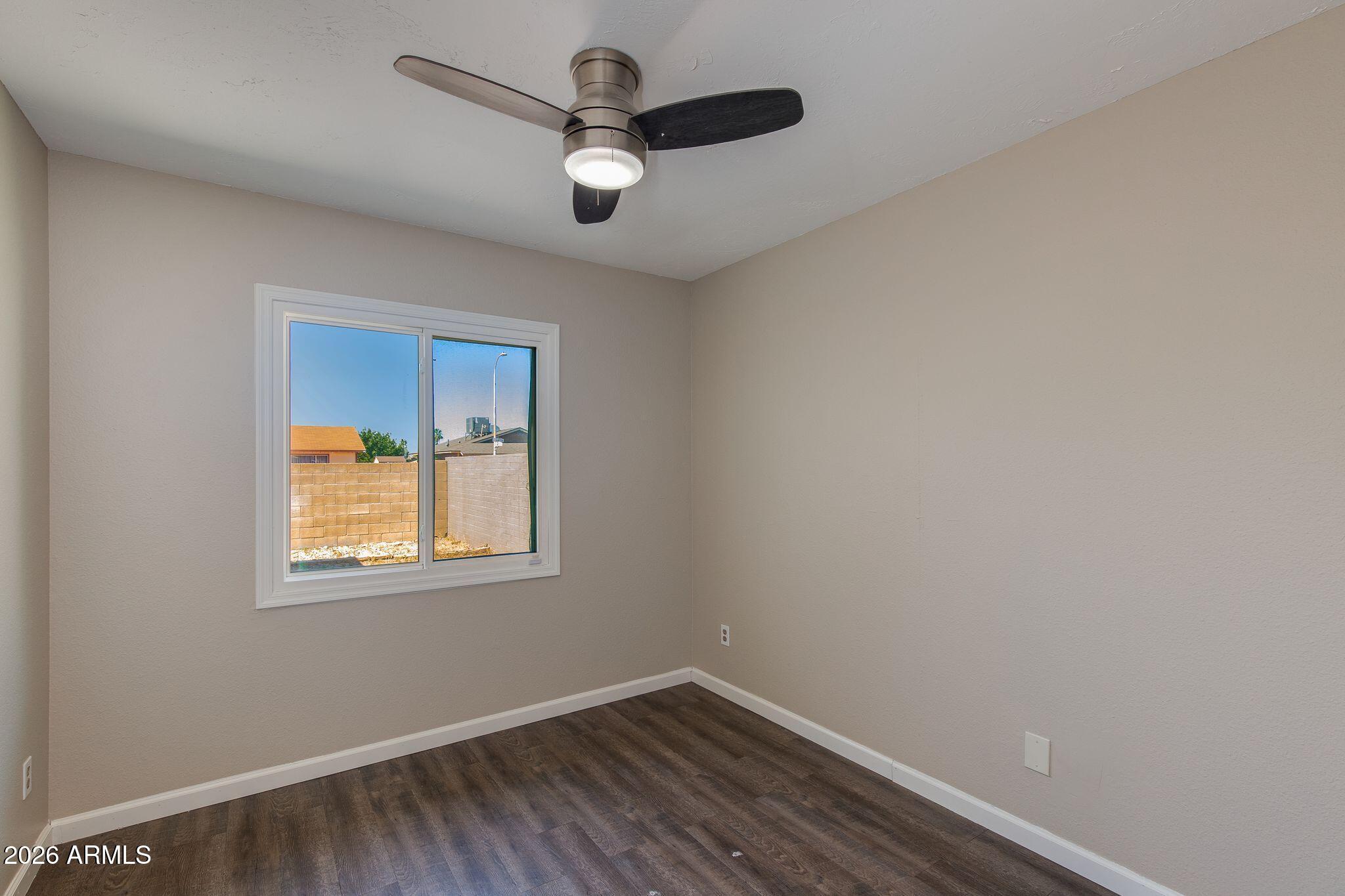 4415 East Chambers Street Phoenix, AZ 85040 - Photo 27 of 33 an empty room with a window