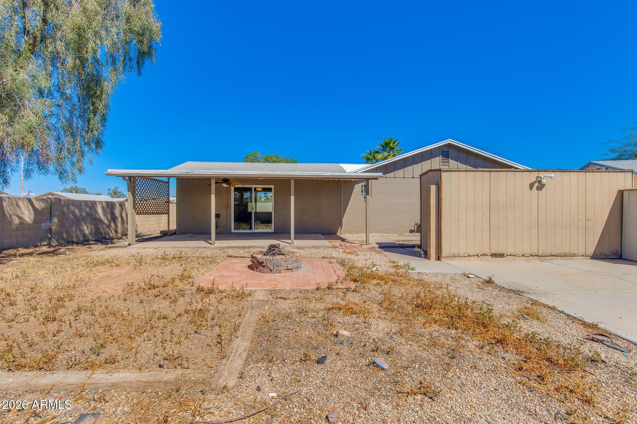 4415 East Chambers Street Phoenix, AZ 85040 - Photo 31 of 33 a view of a house with a yard