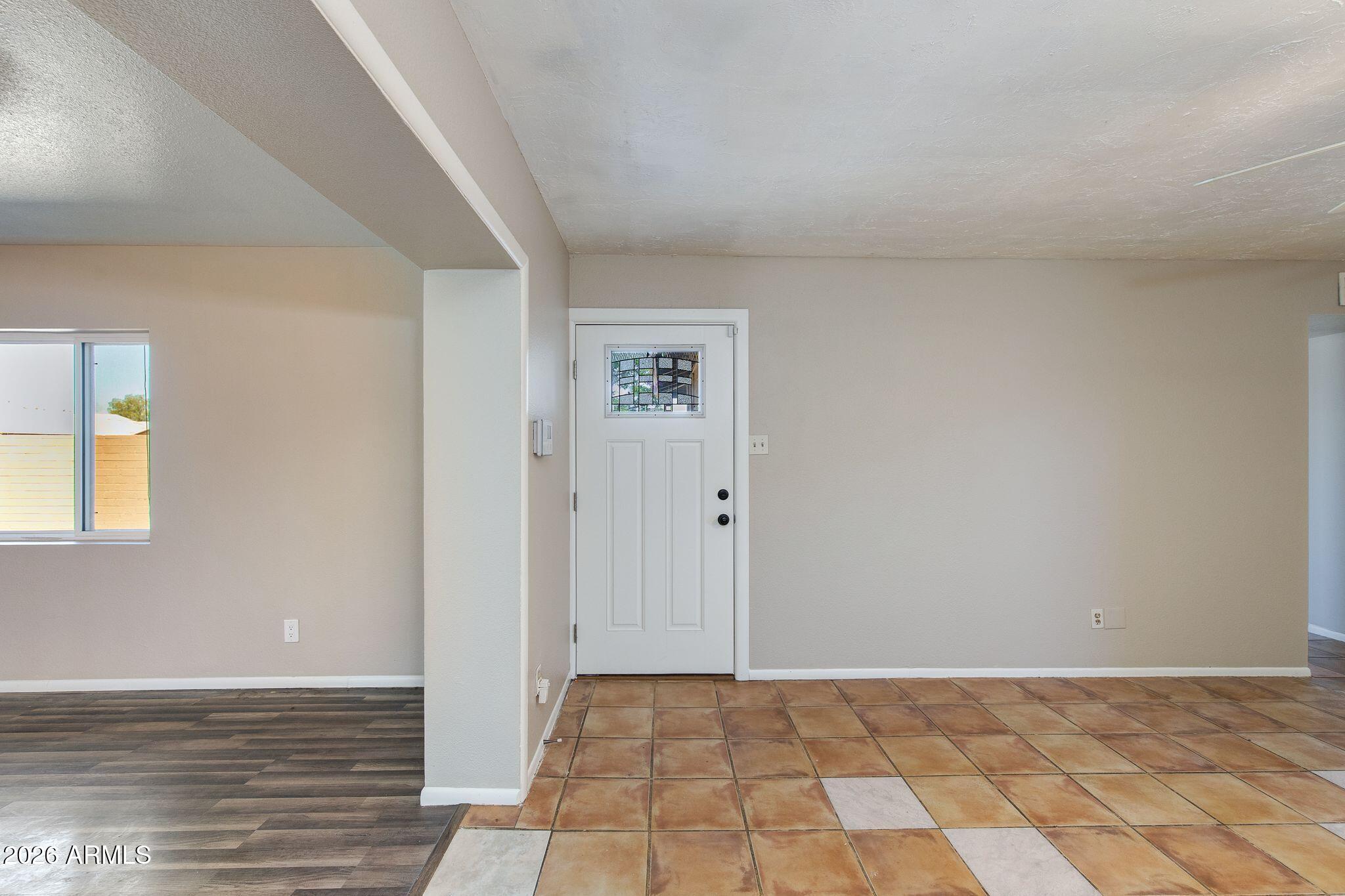 4415 East Chambers Street Phoenix, AZ 85040 - Photo 4 of 33 a view of an empty room and window