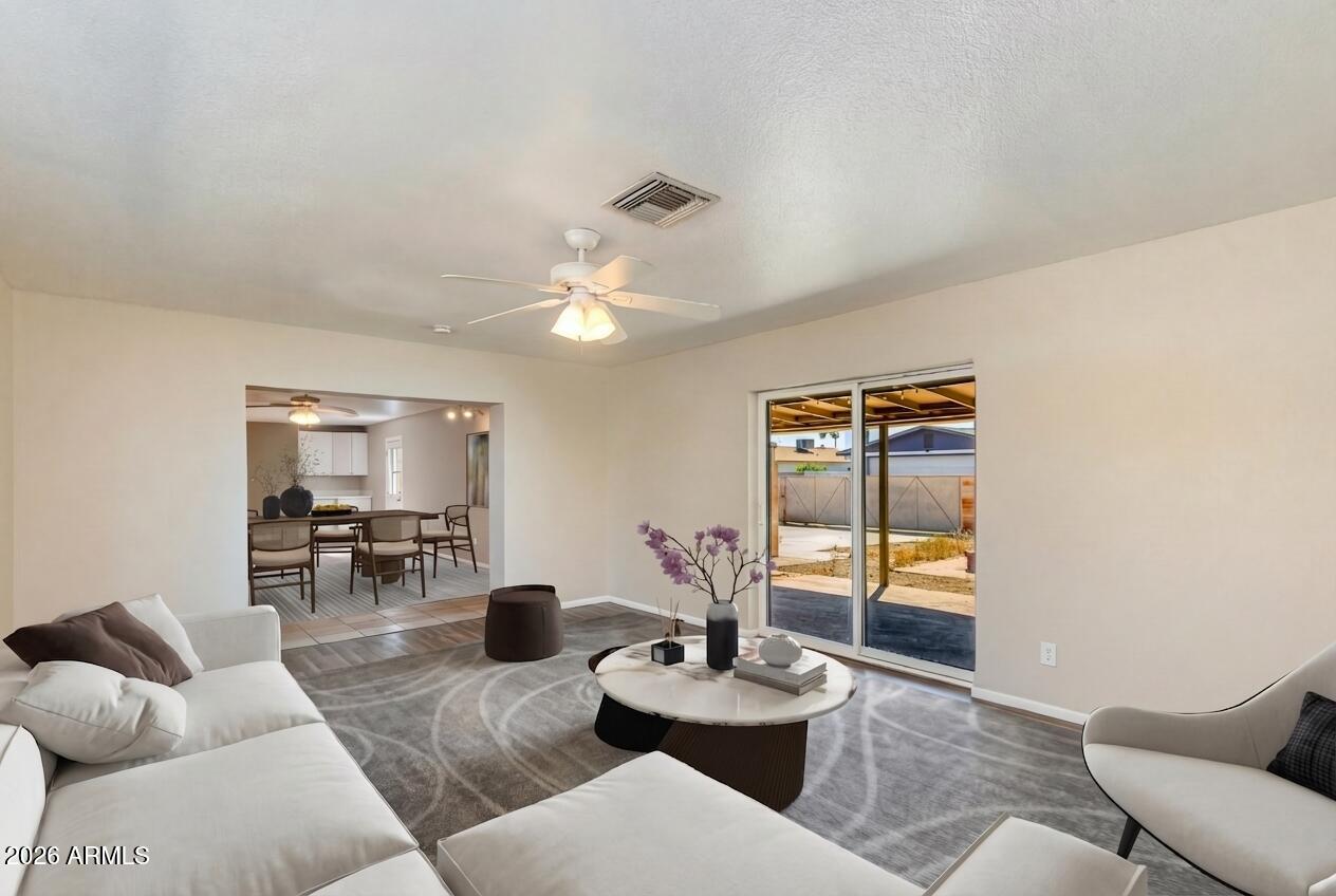 4415 East Chambers Street Phoenix, AZ 85040 - Photo 5 of 33 a living room with furniture and wooden floor