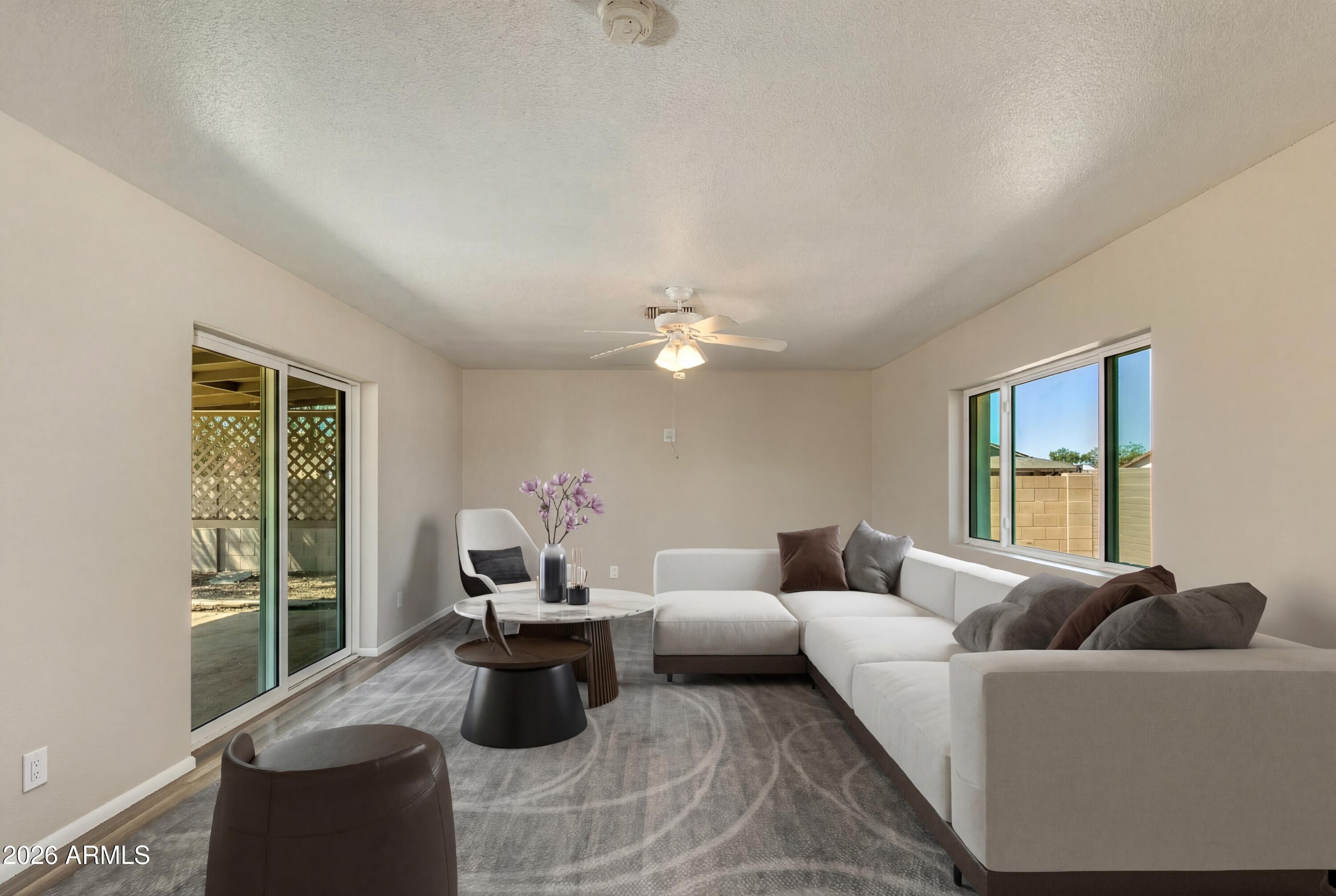4415 East Chambers Street Phoenix, AZ 85040 - Photo 8 of 33 a living room with furniture and a window