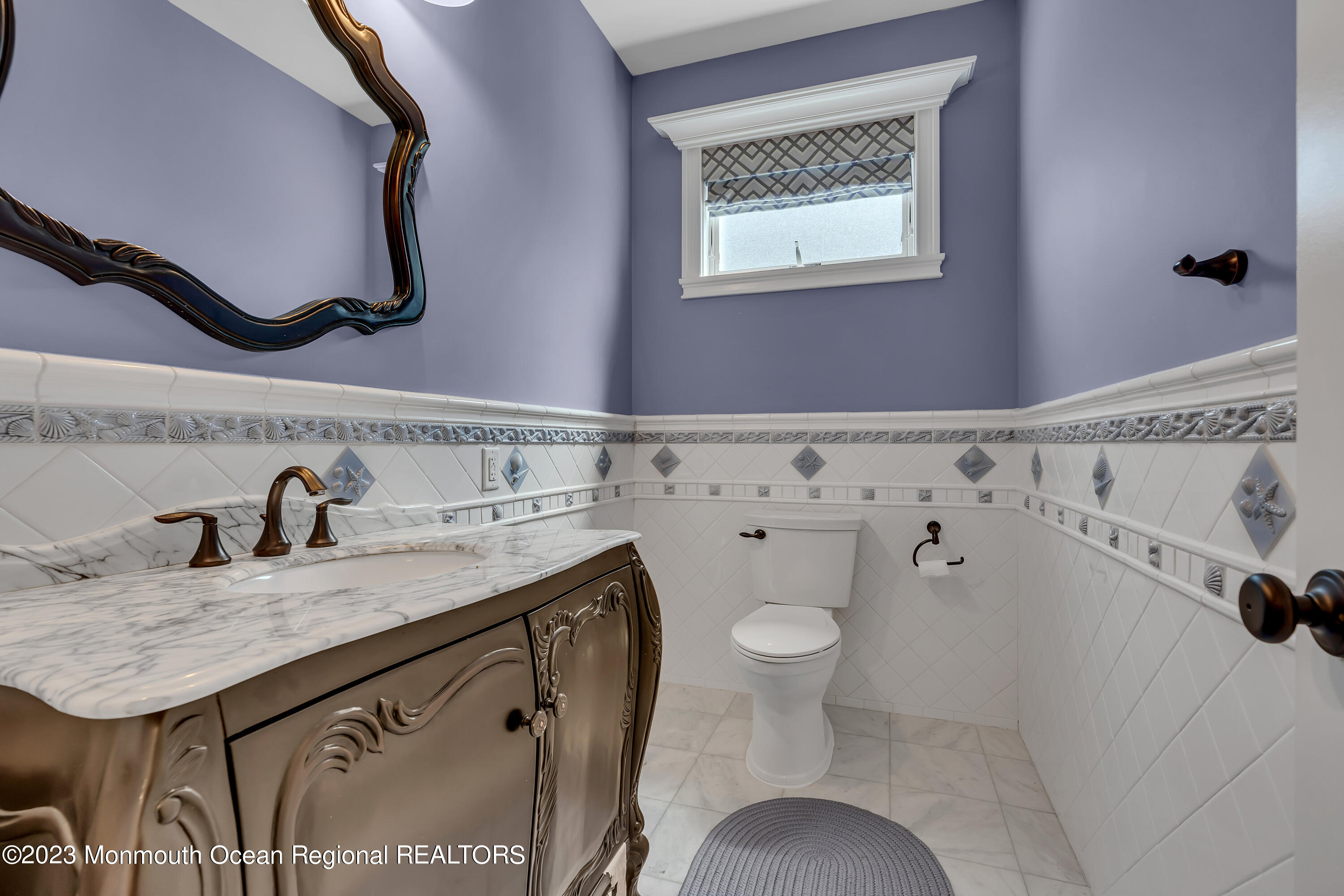 105 Beacon Boulevard Sea Girt, NJ 08750 - Photo 13 of 26 a bathroom with a sink and a toilet