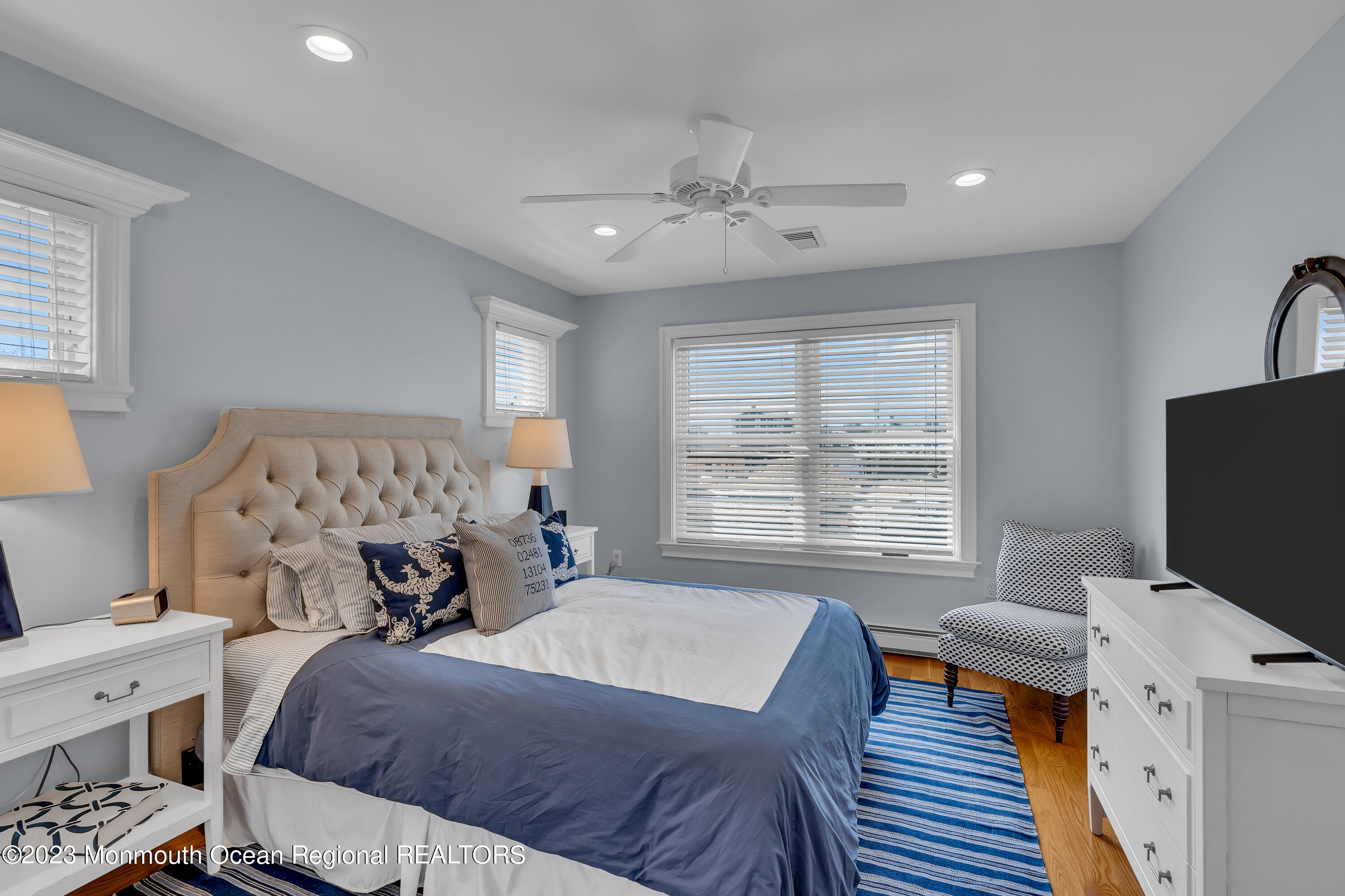 105 Beacon Boulevard Sea Girt, NJ 08750 - Photo 18 of 26 a bedroom with a bed and a tv