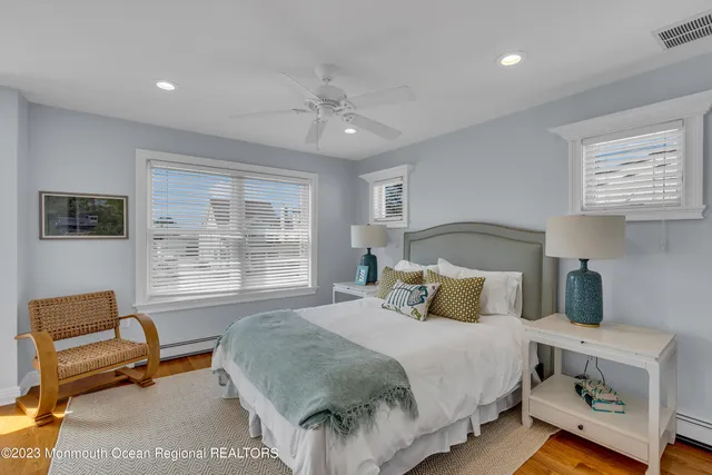 a bedroom with a bed and a couch