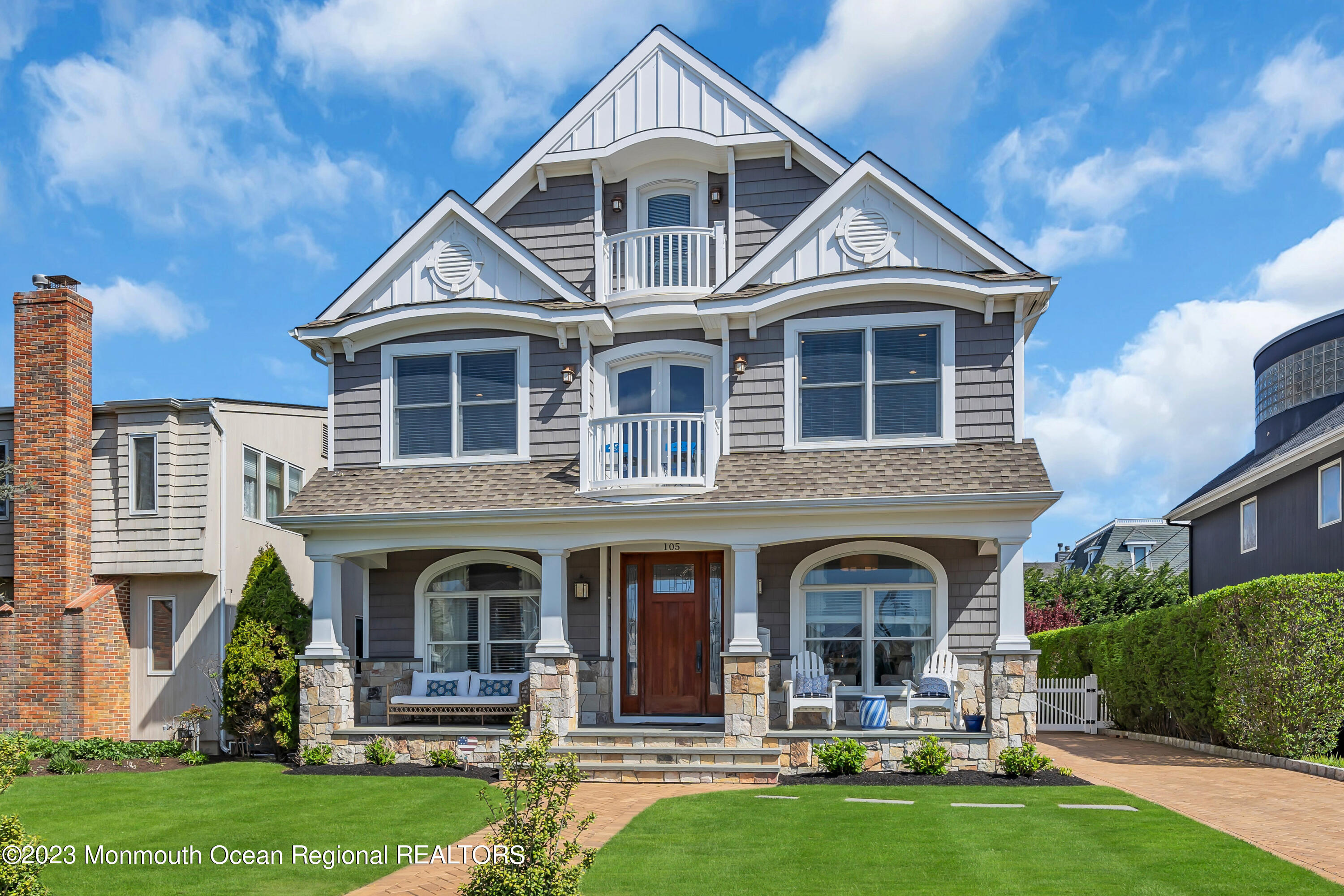 105 Beacon Boulevard Sea Girt, NJ 08750 - Photo 2 of 26 a front view of a house with a yard