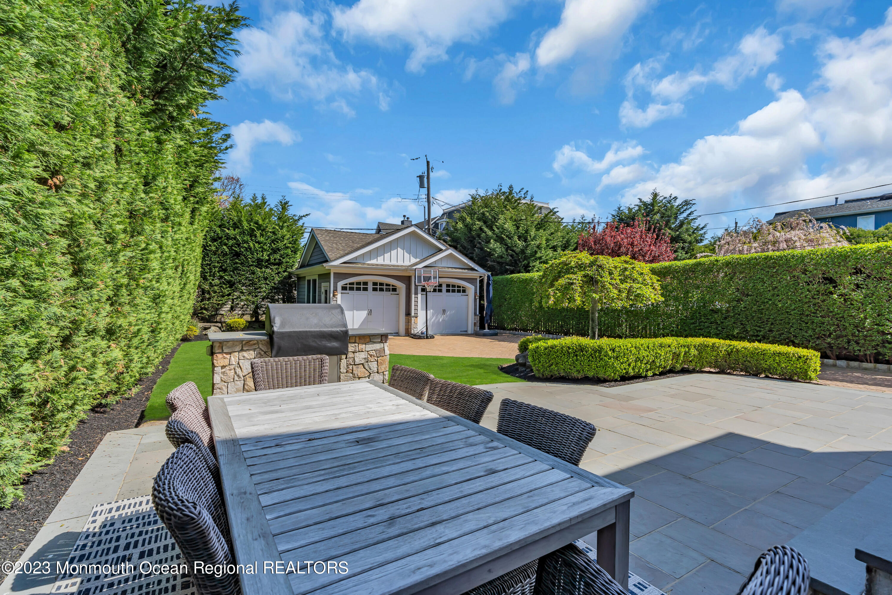 105 Beacon Boulevard Sea Girt, NJ 08750 - Photo 25 of 26 a view of a table and chairs in patio