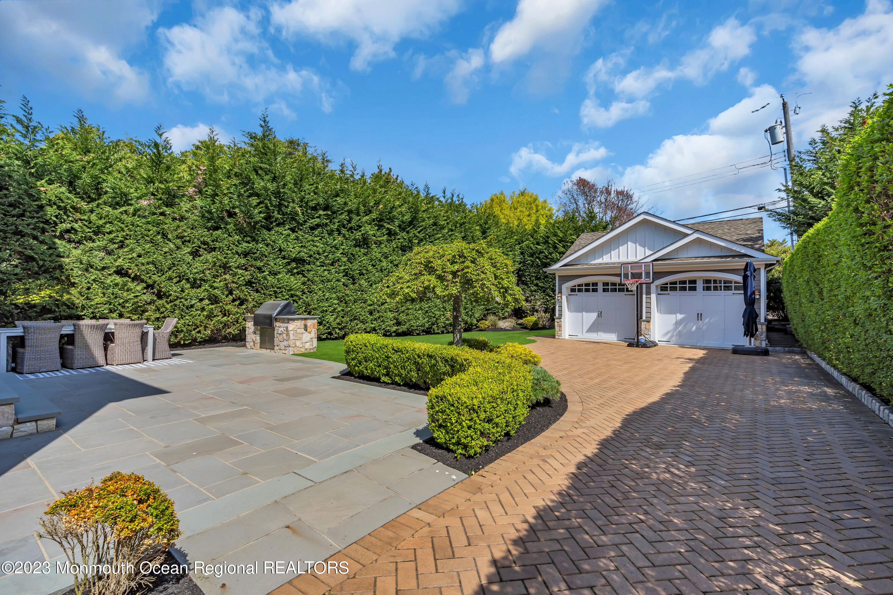 105 Beacon Boulevard Sea Girt, NJ 08750 - Photo 26 of 26 a front view of a house with a yard
