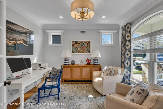 a work room with furniture and a window