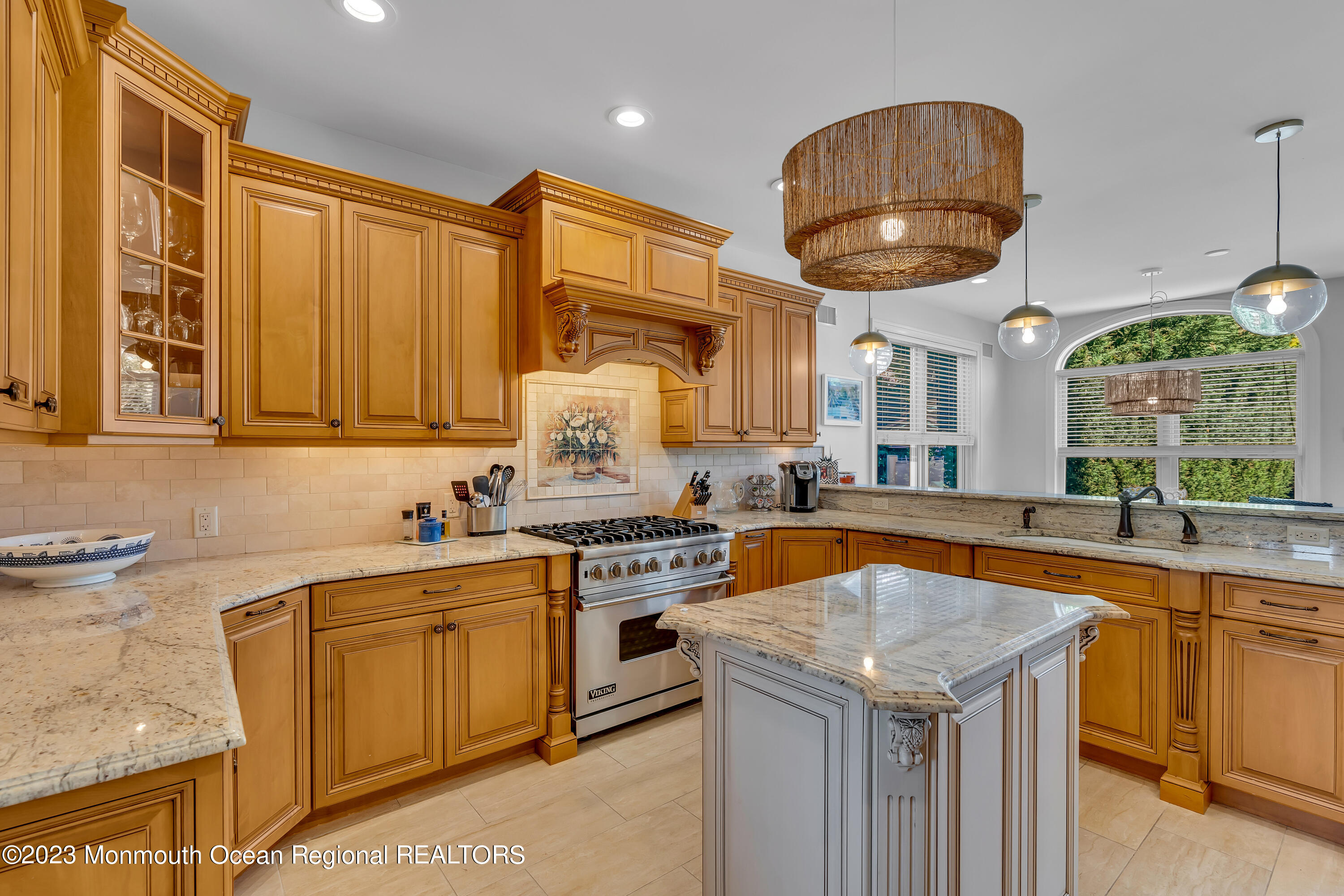105 Beacon Boulevard Sea Girt, NJ 08750 - Photo 6 of 26 a kitchen with a sink a stove and cabinets