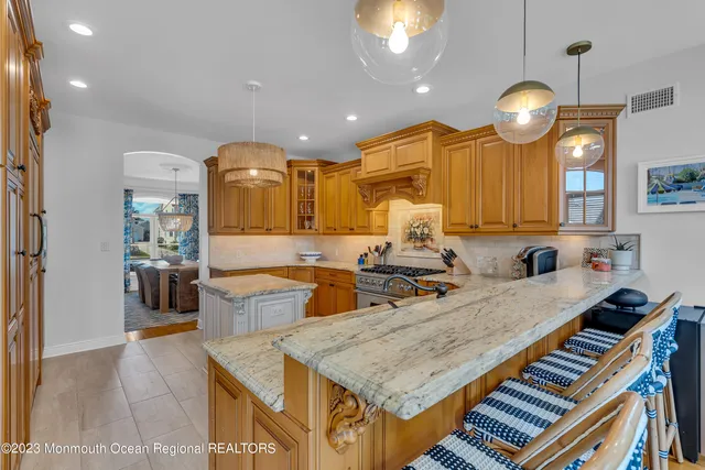 a kitchen with center island and a chandelier