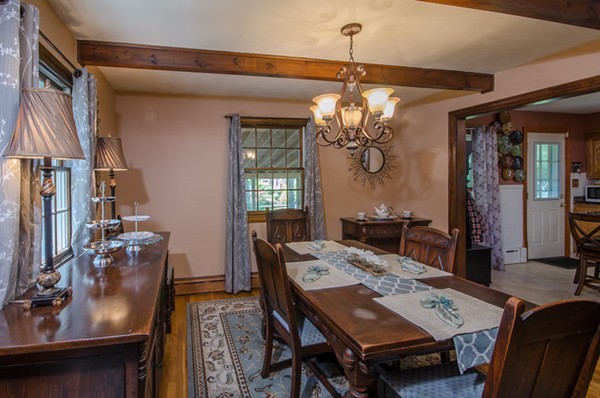328 Mendall Road Acushnet, MA 02743 - Photo 15 of 30 a view of a dining room with furniture and chandelier