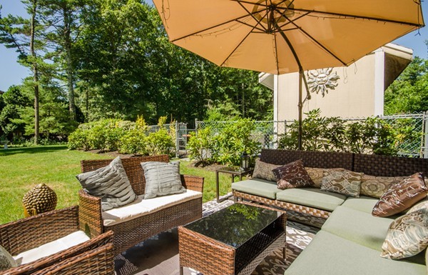 328 Mendall Road Acushnet, MA 02743 - Photo 24 of 30 a view of a patio with couches under an umbrella